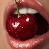 A Close Up Of A Woman S Lips With Cherry Lip Gloss Showcasing The Product In A Visually Appealing Way — Stock Photo