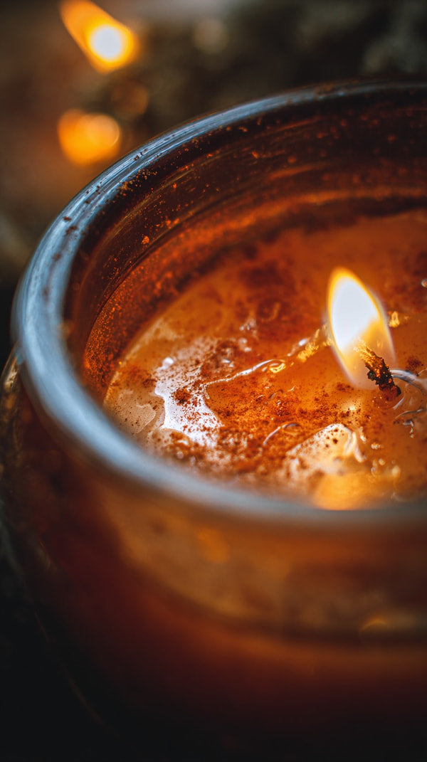 A Lit Candle Inside A Jar With A Wick Visible And A Warm Glow Emanating From It — Stock Photo
