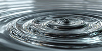a single droplet of water resting on a rippling water surface - Stock Video