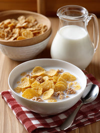 A Bowl Of Cereal With Milk A Carton Of Milk And A Jar Of Cereal On A Wooden Table — Stock Photo