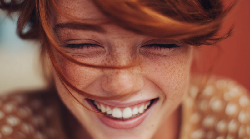 woman with red hair and freckles smiling at camera - Stock Video