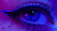 A Close Up Image Of A Human Eye With Blue Makeup Showcasing The Intricate Details And Vibrant Color — Stock Photo