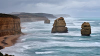 captures the rugged coastline of victoria australia showcasing the iconic rock formations and the vast expanse of the ocean - Stock Video