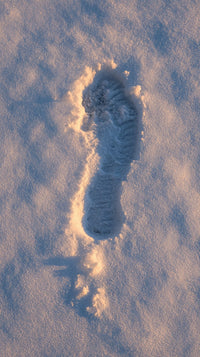 A Single Footprint Is Visible In The Snow Indicating A Recent Human Presence — Stock Photo