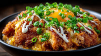 Close Up Of A Plate Of Fried Chicken And Rice Topped With Green Onions And Drizzled With Sauce — Stock Photo