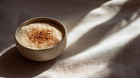 A Cup Of Cinnamon Sits On A Table Casting A Warm Glow Against The Soft Light Filtering Through The Window — Stock Photo