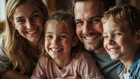 A Family Of Four Posing For A Portrait With A Man And Woman Smiling At The Camera Their Two Children Also Smiling — Stock Photo