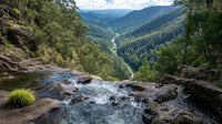 Aerial View Of A Mountainous Landscape With Lush Greenery A Winding River And A Clear Blue Sky — Stock Photo