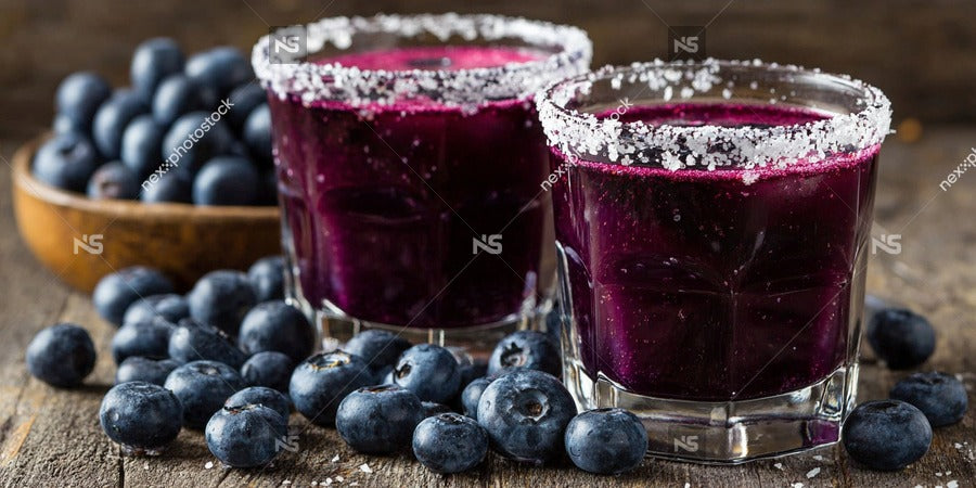 Blueberry Margarita Shots With Blueberries And Salted Rims Served In Clear Shot Glasses On A Wooden Surface — Stock Photo