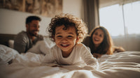 A Young Child Is Smiling In A Bedroom Surrounded By Family Members Who Are Also Present — Stock Photo