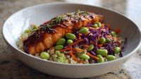 A Bowl Of Asian Inspired Food Including Fish And Vegetables Served On A Dining Table — Stock Photo