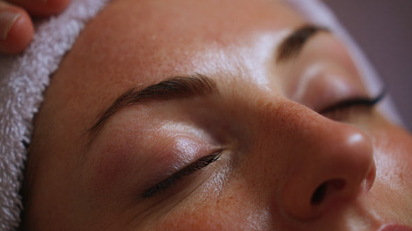 A Close Up Photograph Of A Person S Face With Their Eyes Closed Focusing On Their Facial Features And The Surrounding Area — Stock Photo