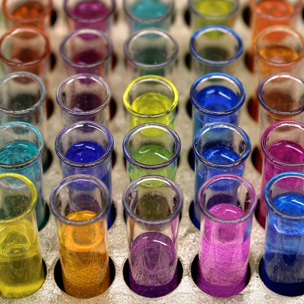 Colorful Test Tubes With Various Colored Liquids Arranged In A Row On A Table — Stock Photo
