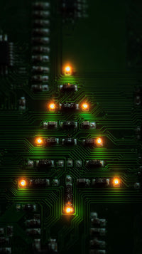 A Printed Circuit Board With A Christmas Tree Decoration Three Small Lights Arranged In A Triangular Shape To Resemble A Christmas Tree — Stock Photo
