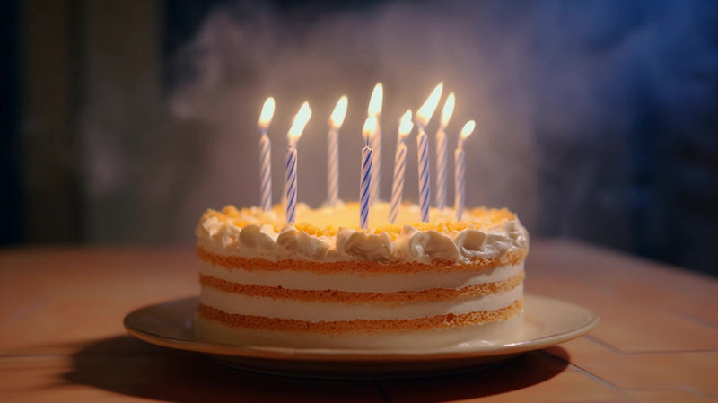 a birthday cake with candles in front of a smoke machine creating a celebratory atmosphere - Stock Video