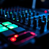 Dj Mixing Console With Illuminated Knobs And Faders Set Against A Dark Background — Stock Photo