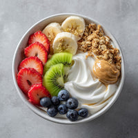A Vibrant Yogurt Parfait Bowl Filled With Granola Fresh Fruit And Honey Presented In A White Bowl — Stock Photo