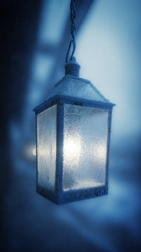 A Blue Lantern Hangs From A Chain In A Dark Room Casting Light On The Background — Stock Photo