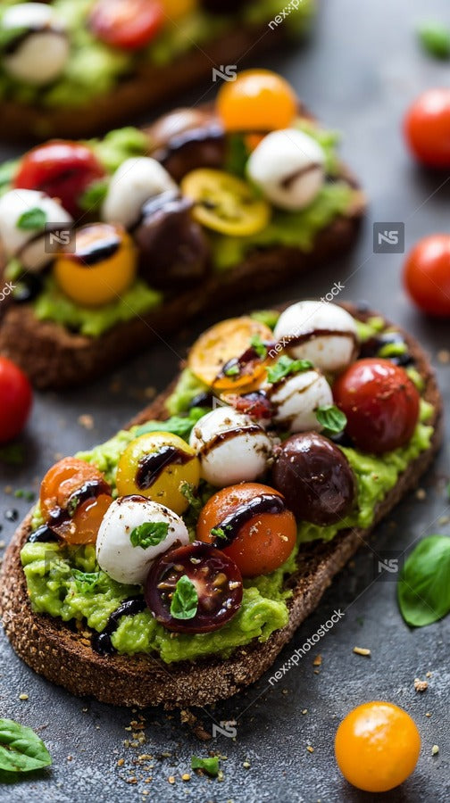 Avocado Toast Topped With Cherry Tomatoes Olives And Drizzled With Olive Oil On A Wooden Cutting Board — Stock Photo
