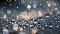 drops of water falling from a source creating a pattern against a dark background with bokeh lights - Stock Video