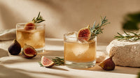 Gin And Tonic Cocktails Garnished With Rosemary And Fennel Served In Glasses On A Table — Stock Photo