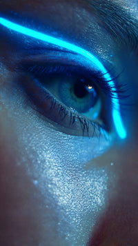 A Close Up Portrait Of A Person With A Striking Blue Eye And A Glowing Neon Line Running Across Their Face — Stock Photo