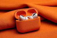 Shows A Pair Of White Earbuds With Black Accents Inside An Orange Fabric Case — Stock Photo