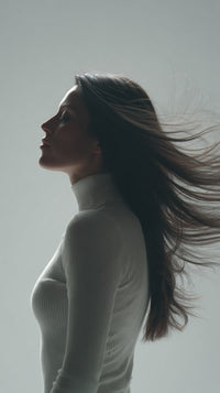 A Portrait Of A Woman With Long Hair Captured In Mid Motion As She Turns Her Head To The Side — Stock Photo