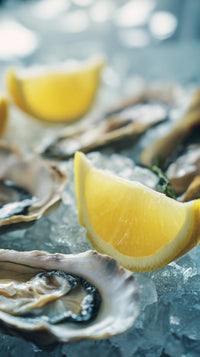 oysters on ice with lemon wedges - Stock Video