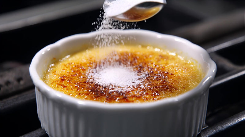 a white bowl filled with baking flour is placed on a grill with a spoon resting inside it - Stock Video