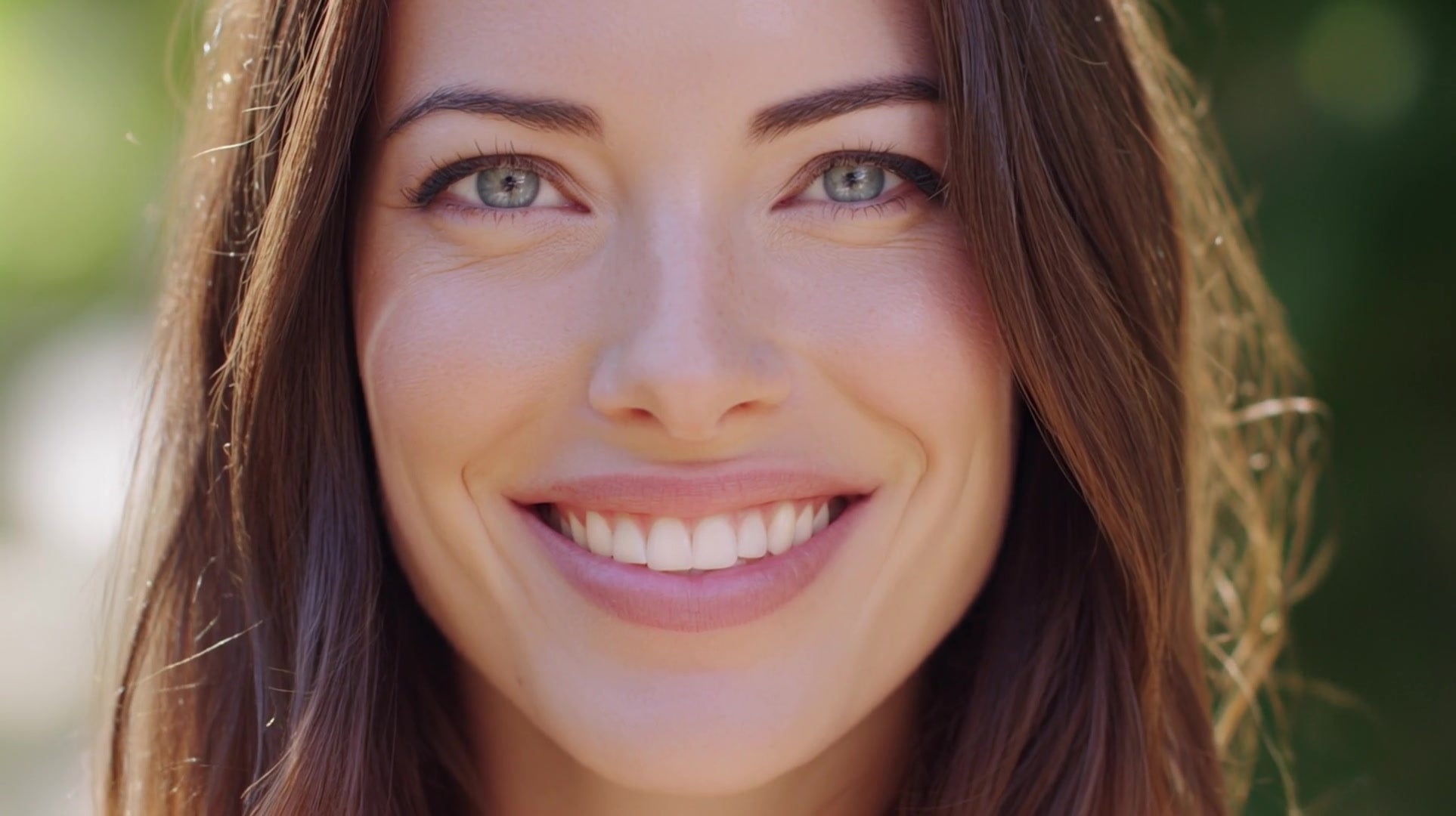a woman is smiling in a portrait style image - Stock Video