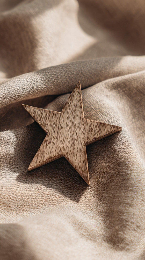 A Wooden Star Is Placed On A Textured Surface Which To Be A Fabric With A Soft Texture — Stock Photo