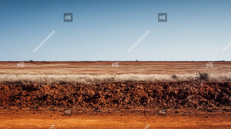 Aerial View Of A Dirt Road In The Australian Outback With Clear Blue Skies And Sparse Vegetation — Stock Photo