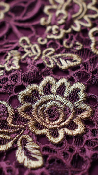 A Close Up Of A Purple Lace Fabric Adorned With Gold Embroidery Showcasing Intricate Patterns And Designs — Stock Photo