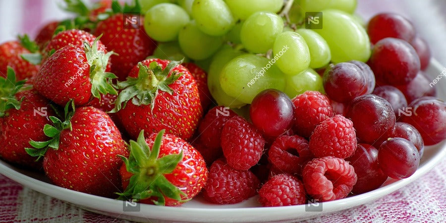 A Platter Of Fresh Fruit Including Grapes Strawberries And Melons Displayed On A Table — Stock Photo
