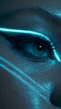 A Close Up Portrait Of A Person With Striking Blue Eyes And A Glittery Teal Colored Makeup Design On Their Face — Stock Photo