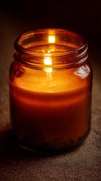 Amber Candle In A Glass Jar — Stock Photo