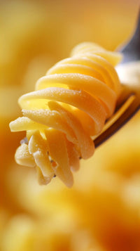 macro close up of a spiral pasta twist with a focus on its texture and shape - Stock Video
