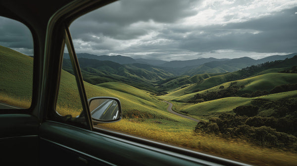 A Car Window View Of A Scenic Landscape Rolling Hills And A Winding Road — Stock Photo