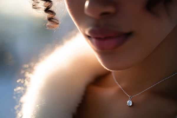 A Close Up Image Of A Person Wearing A Necklace — Stock Photo