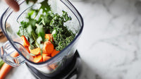 fresh vegetables in a blender - Stock Video