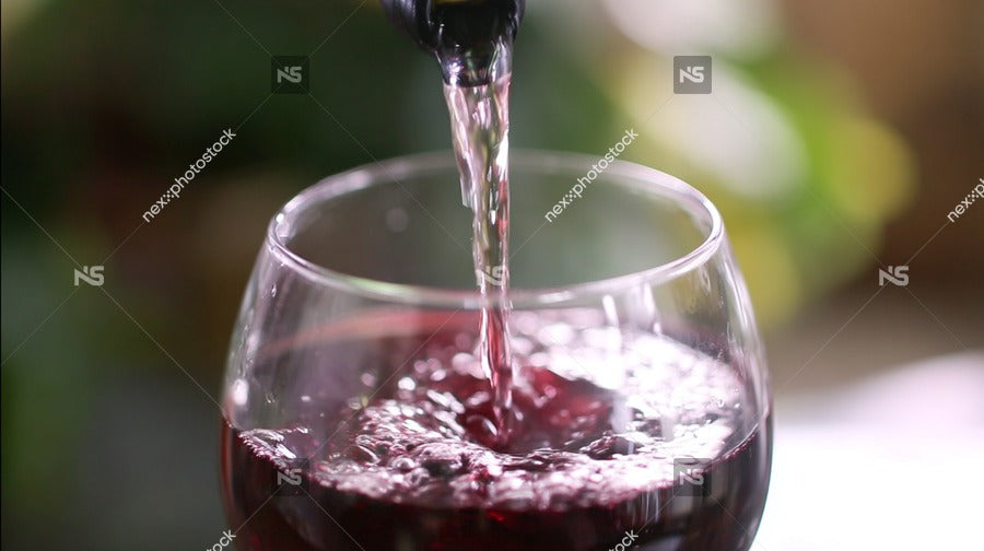 Wine Glass Pouring Red Wine — Stock Photo