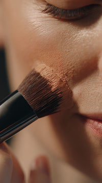 Woman Applying Makeup With A Brush — Stock Photo
