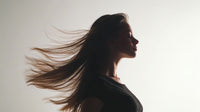 long hair movement portrait of a woman with flowing locks captured in motion against a white background - Stock Video