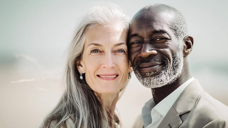 a man and a woman both middle aged share an embrace in a beach setting - Stock Video