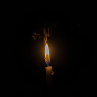 A Single Lit Candle Against A Black Background 2 — Stock Photo