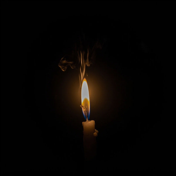 A Single Lit Candle Against A Black Background 2 — Stock Photo