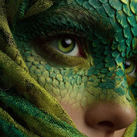 A Person Wearing A Lizard Themed Costume With Green And Yellow Scales Covering Their Face And Body Peeking Through A Veil Of Fabric — Stock Photo