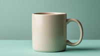 A Cream Colored Mug Is Placed On A Teal Surface — Stock Photo