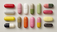 A Collection Of Colorful Pills Displayed In A Row Showcasing Various Shapes And Sizes Against A White Background — Stock Photo